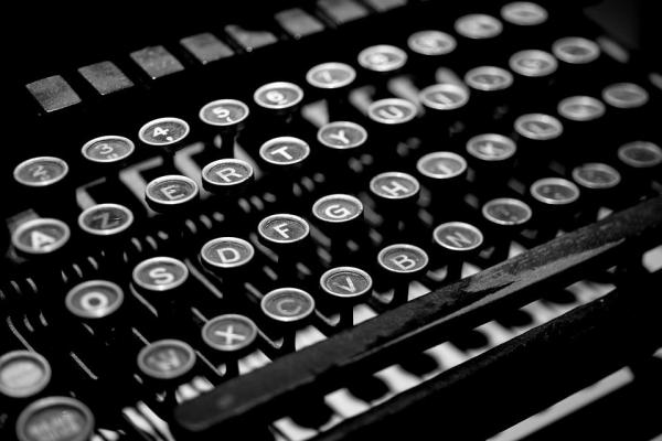 Black and White image of a typewriter keyboard.